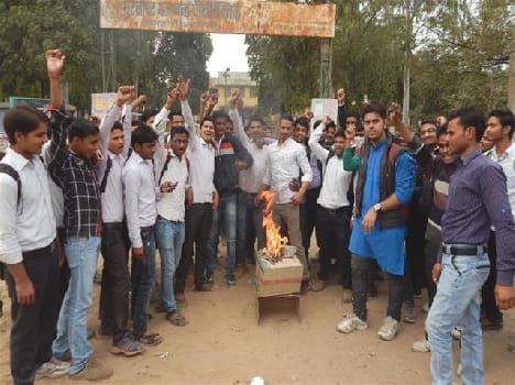 Burned effigies of the principal student assaulted